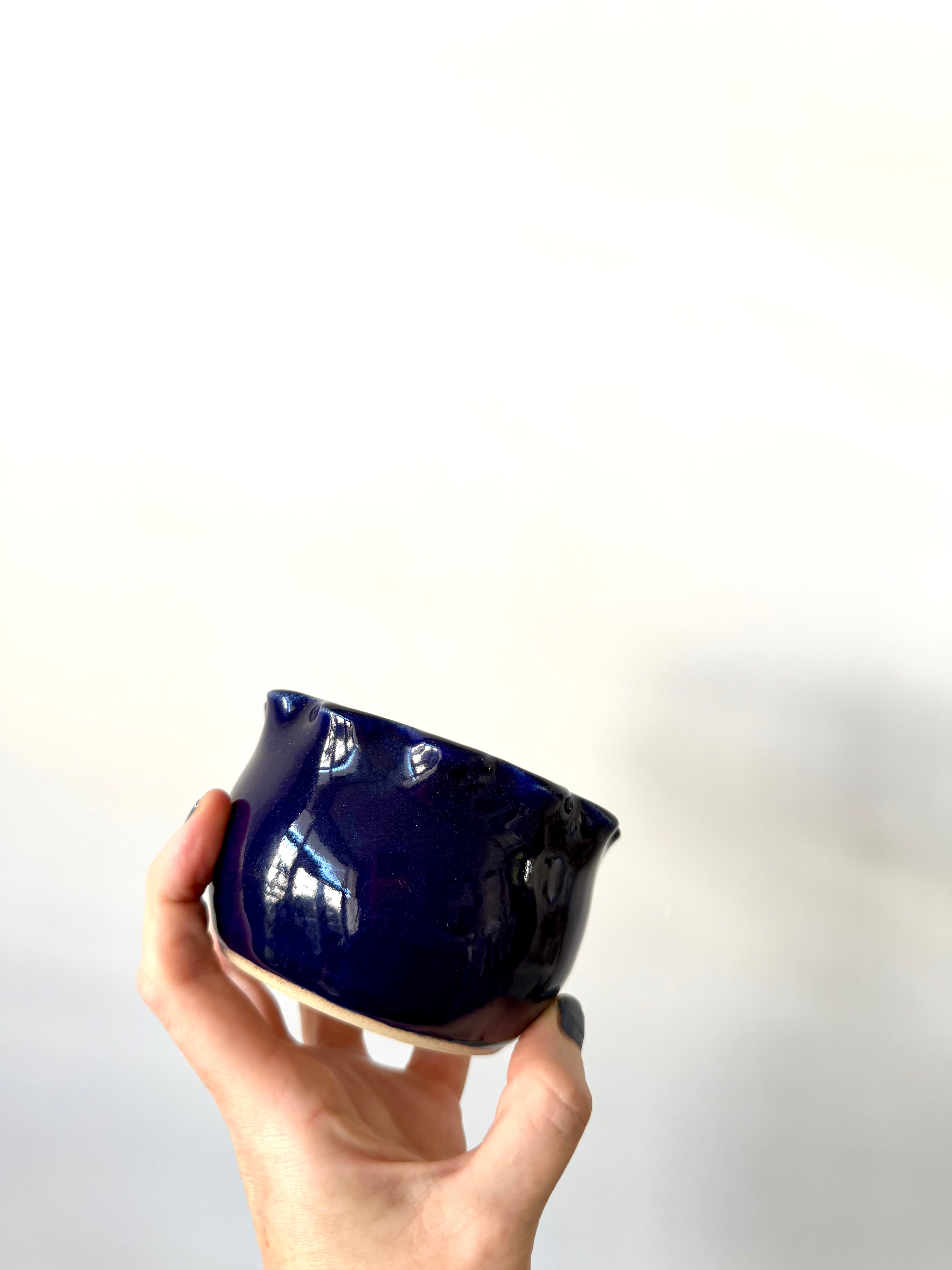 Soy wax candle in a handmade ceramic cup