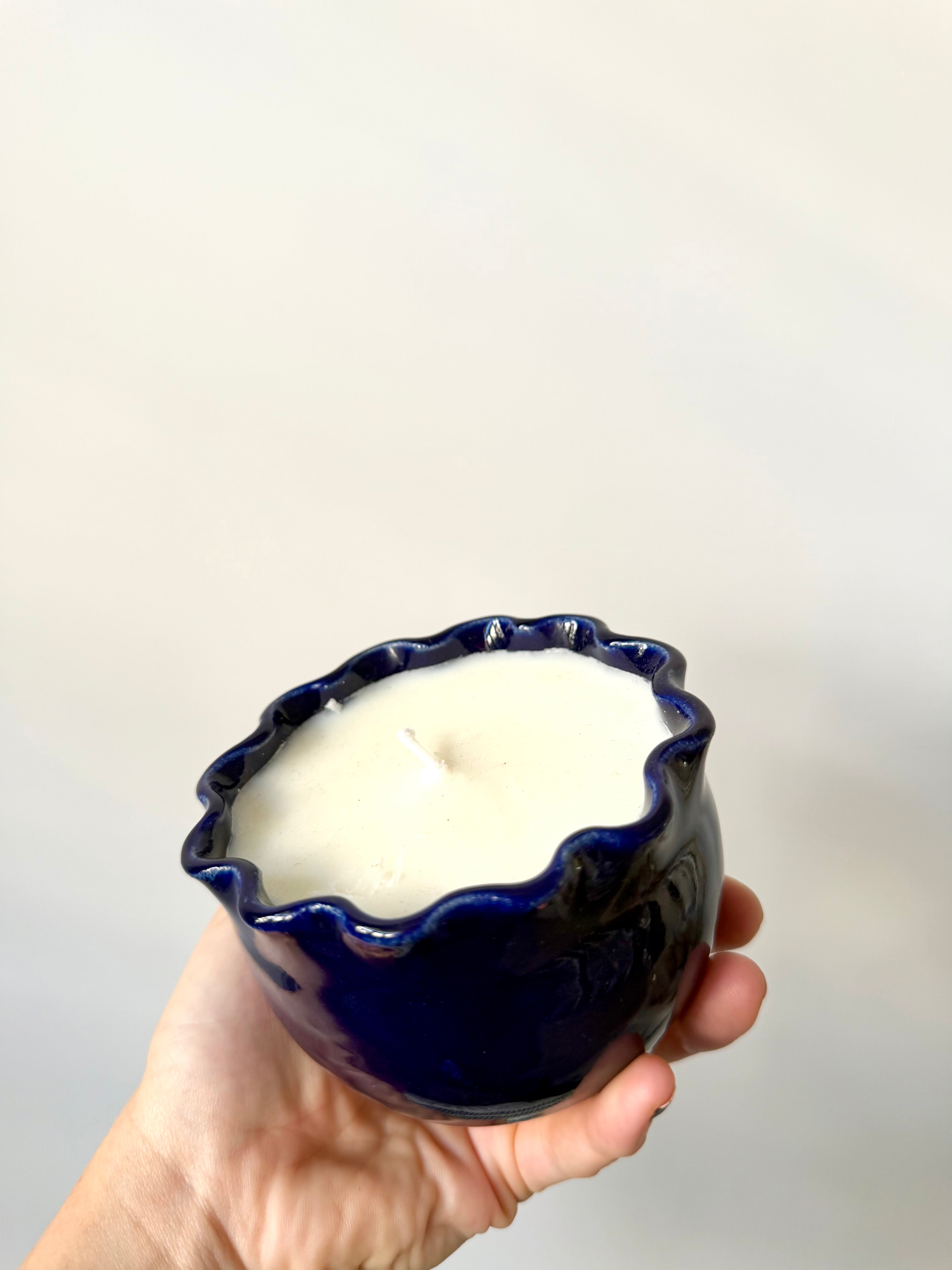 Soy wax candle in a handmade ceramic cup