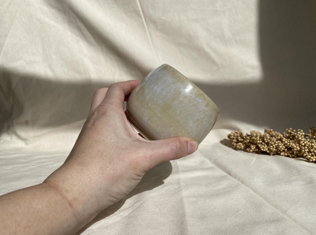 Eucalyptus soy wax candle in a ceramic cup