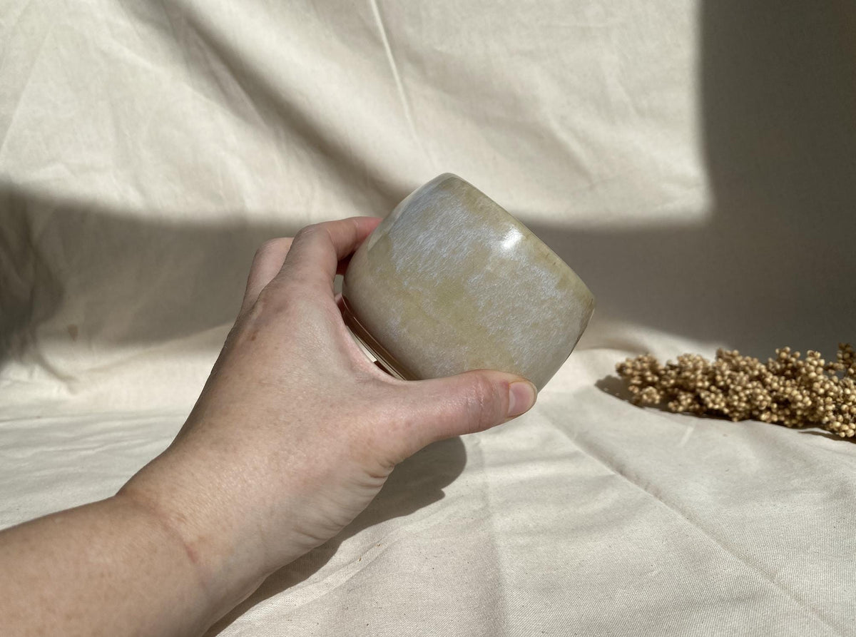 Eucalyptus soy wax candle in a ceramic cup