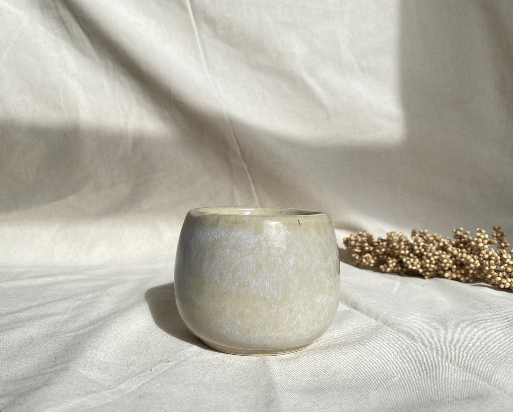 Eucalyptus soy wax candle in a ceramic cup