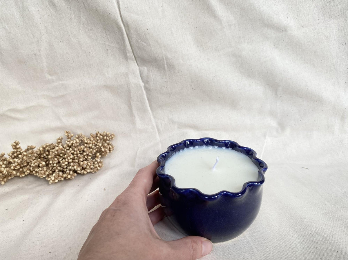 Soy wax candle in a handmade ceramic cup
