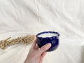 Soy wax candle in a handmade ceramic cup