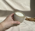 Eucalyptus soy wax candle in a ceramic cup