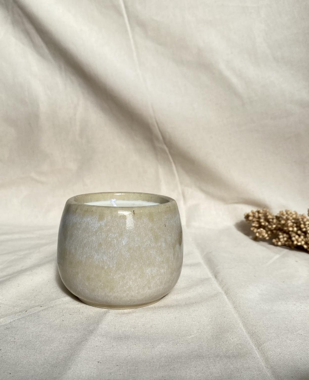 Eucalyptus soy wax candle in a ceramic cup