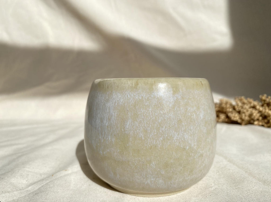 Eucalyptus soy wax candle in a ceramic cup
