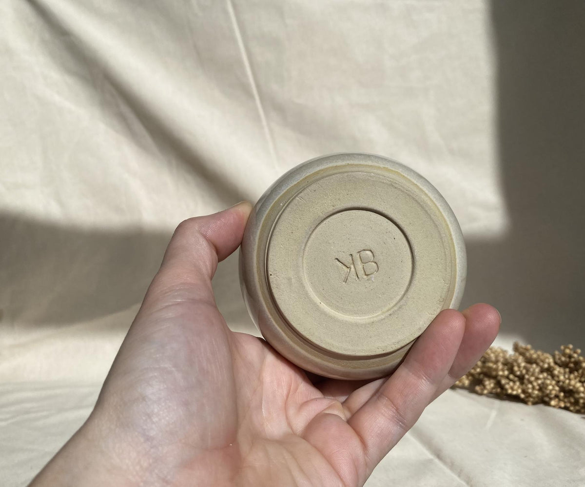 Eucalyptus soy wax candle in a ceramic cup