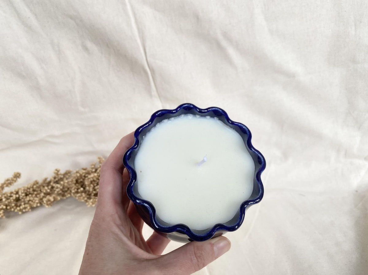 Soy wax candle in a handmade ceramic cup